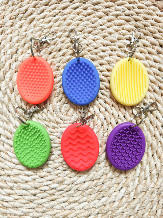 Porte clé sensoriel en silicone texturé